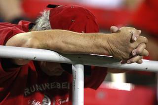 A UNLV fan hangs his head late in the fourth quarter of their game against Washington State Friday, Sept. 14, 2012 at Sam Boyd Stadium. Washington State won the game 35-27, dropping UNLV to 0-3 on the season.